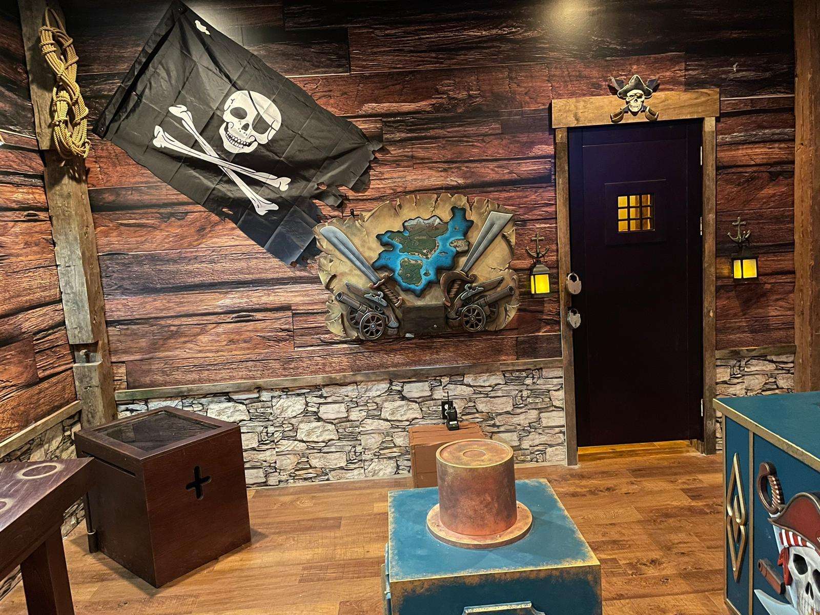 Legend of the Shoals pirate escape room by Indestroom at Monkey Mind, Portsmouth: the Jolly Roger and the treasure wall