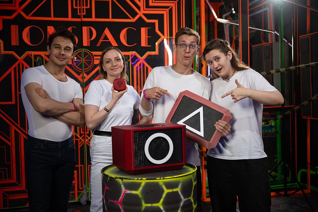 Four players with the Impostors portable strategy game cube